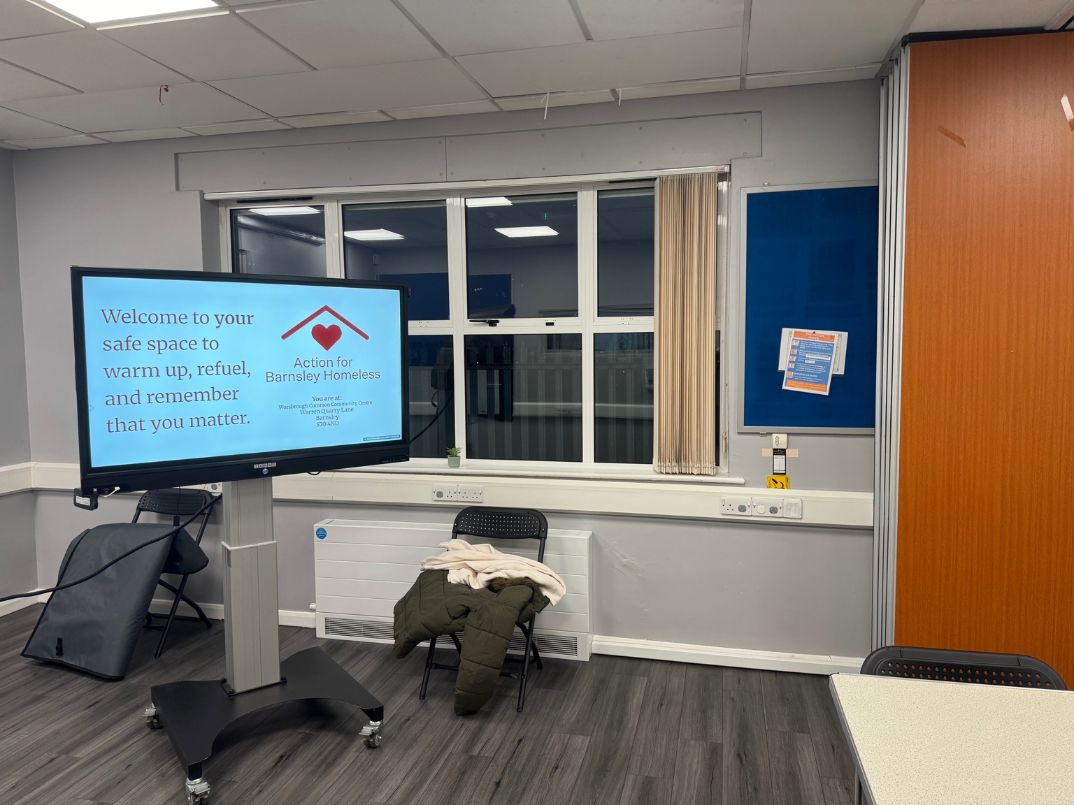 A screen displaying a welcome message inside the community space.